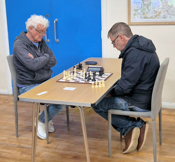 Two people playing chess