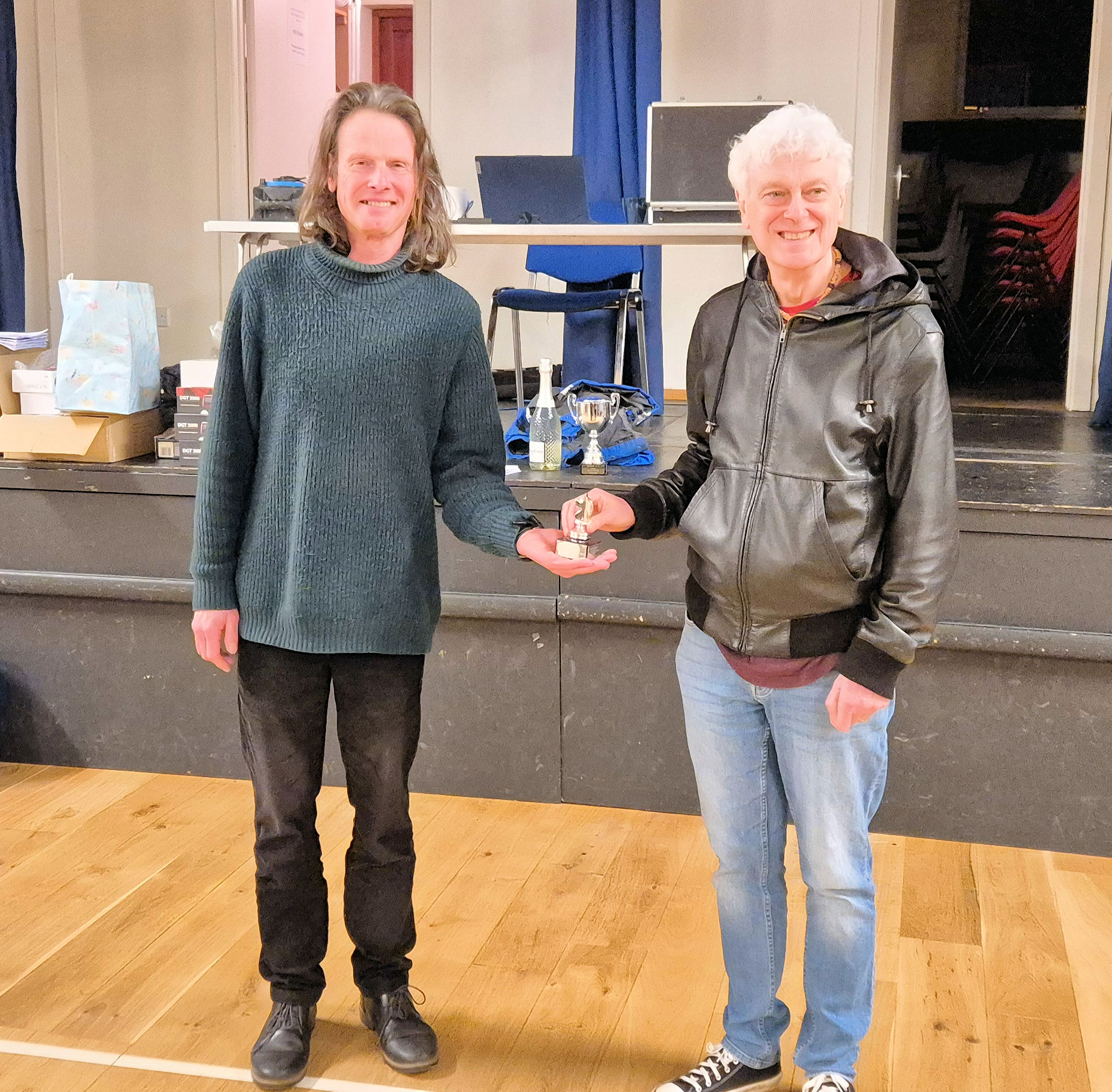 Chris Lowe and John Nunn standing with a trophy